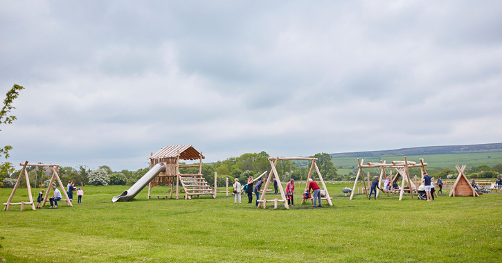 Mixture of children and adults enjoying the playground at Derwent Waterside Park 